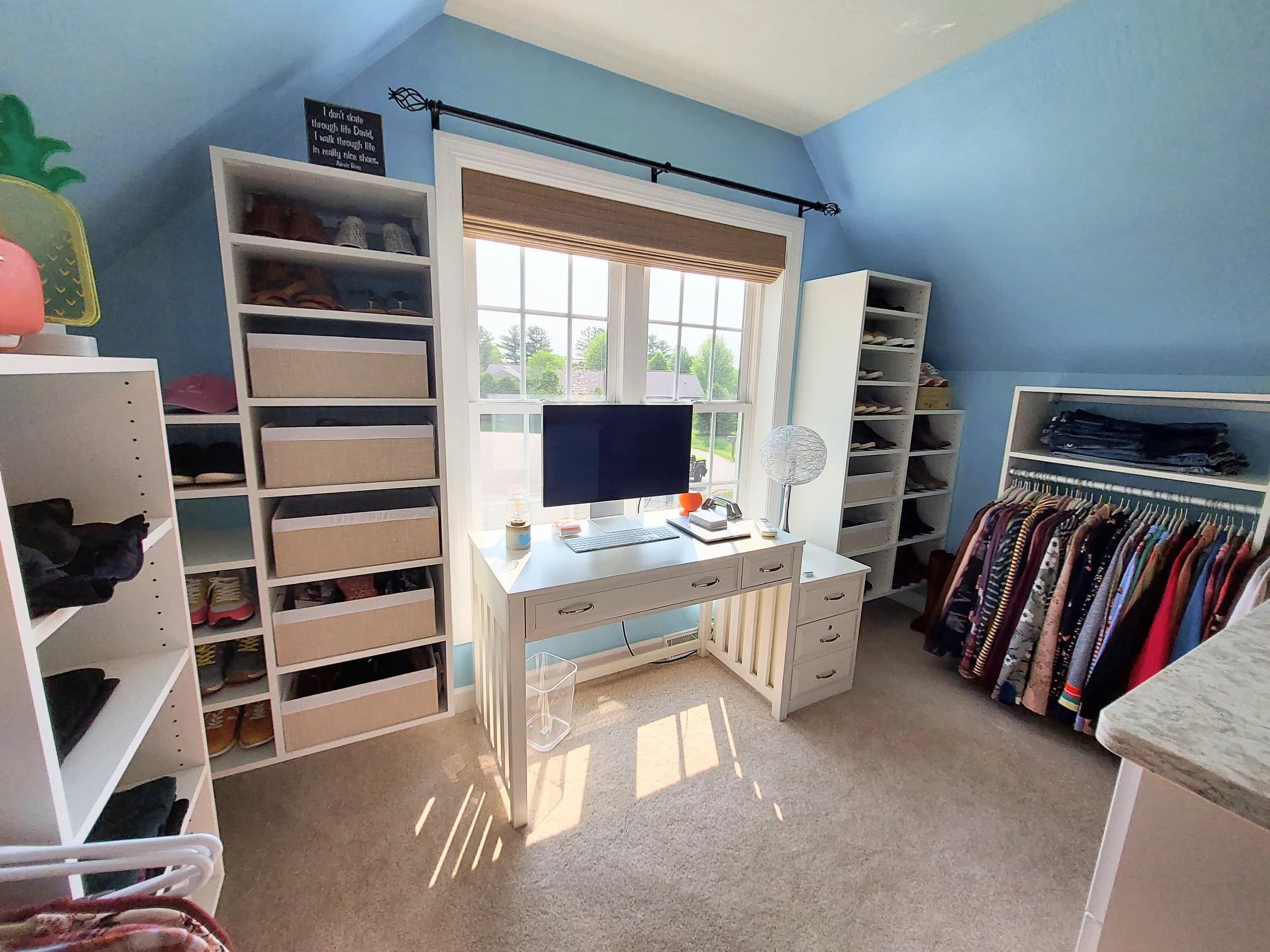 A closet with a built-in desk