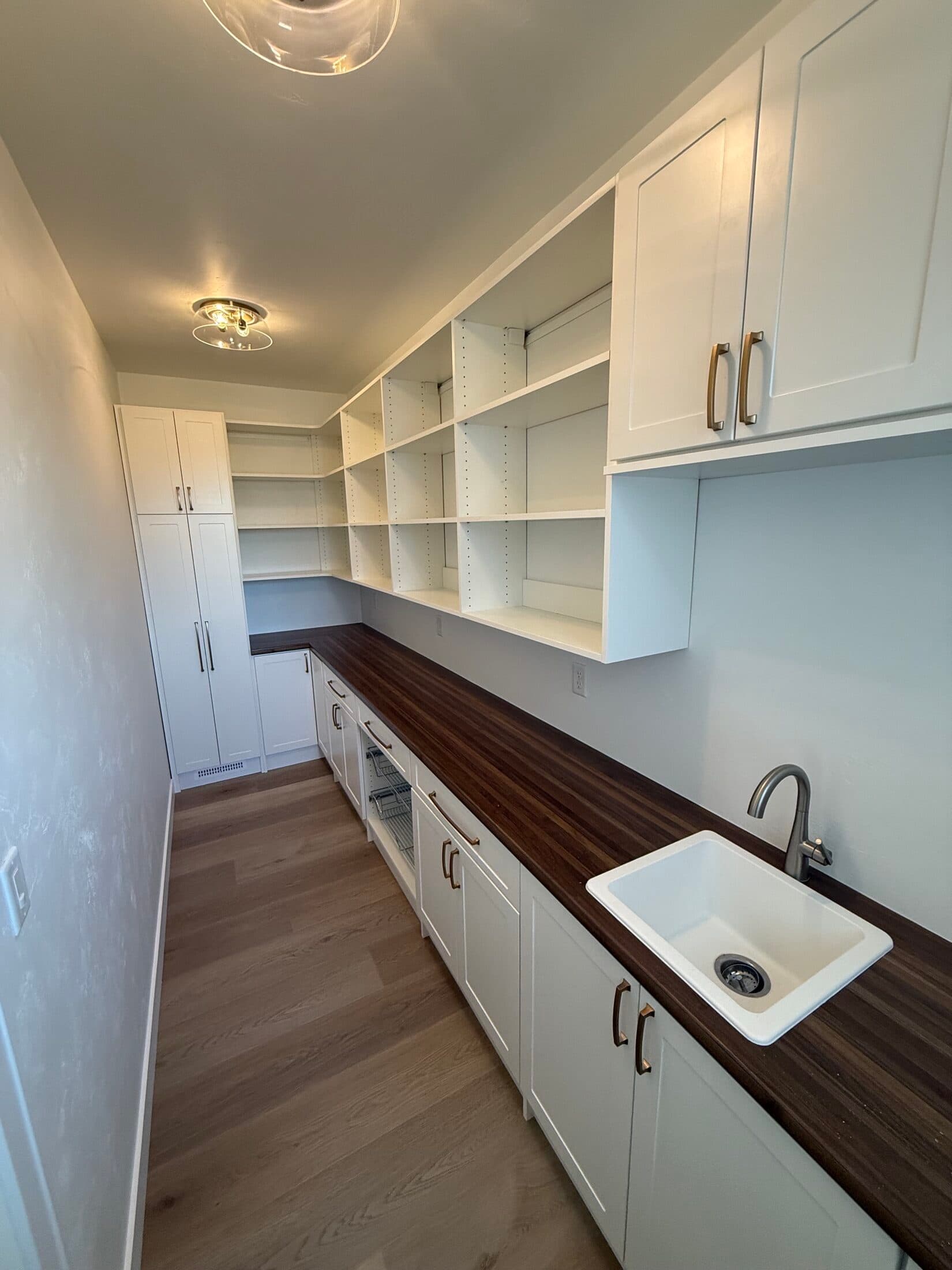 Laundry Room Portfolio: White Utility Room with Walnut Counter