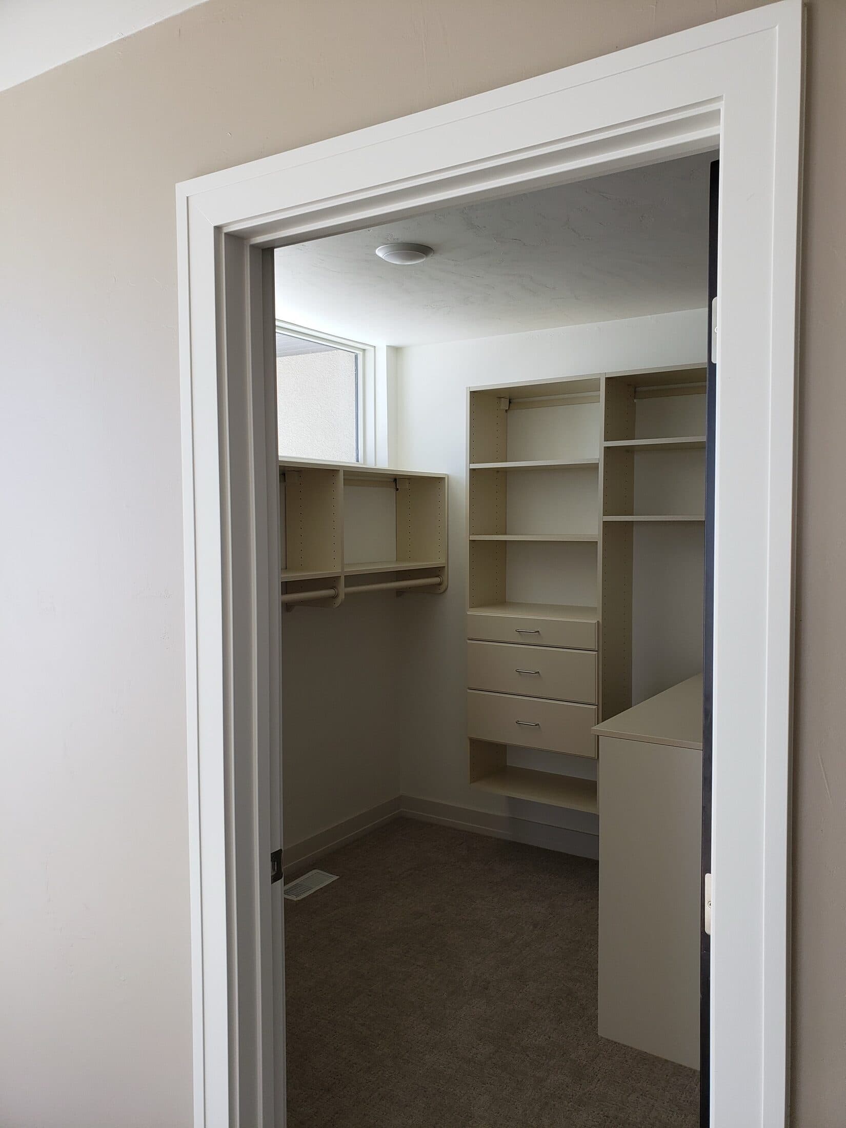 Walk-In Closet Portfolio: Windowed White Walk-In with Floating Drawers