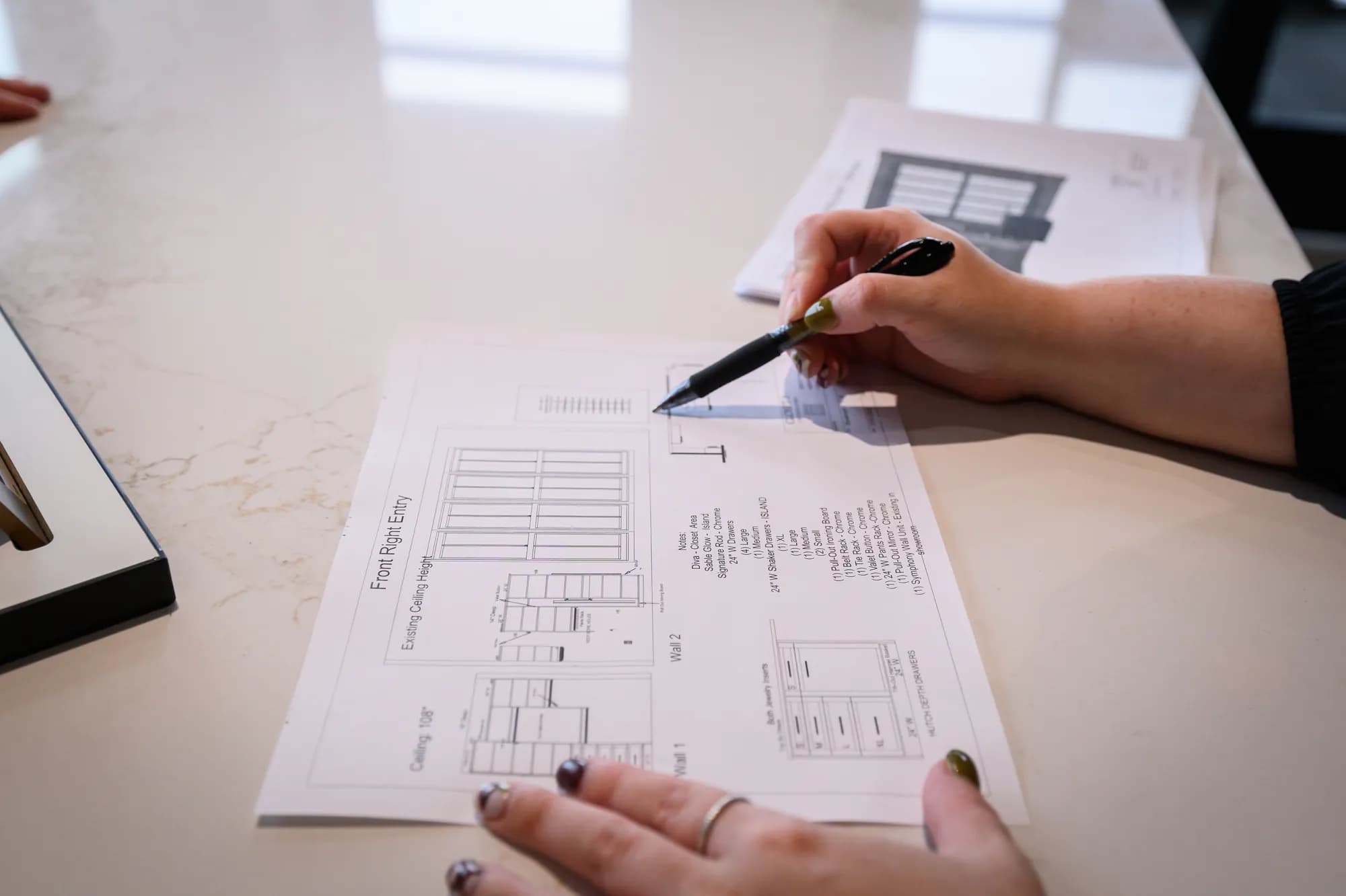A Closet 1 designer marks up a closet design drawing