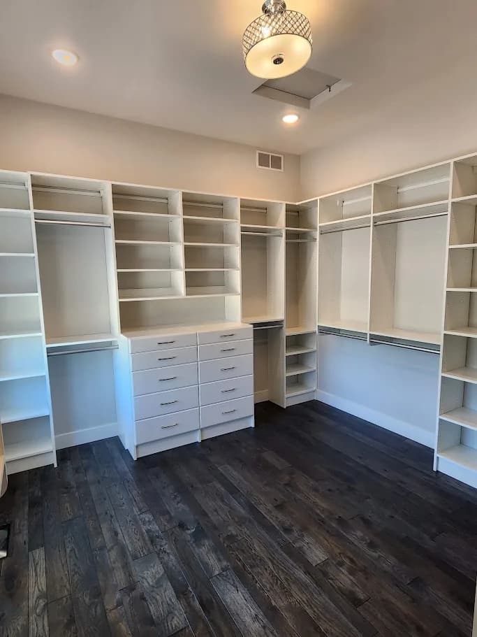 A finished white walk-in closet