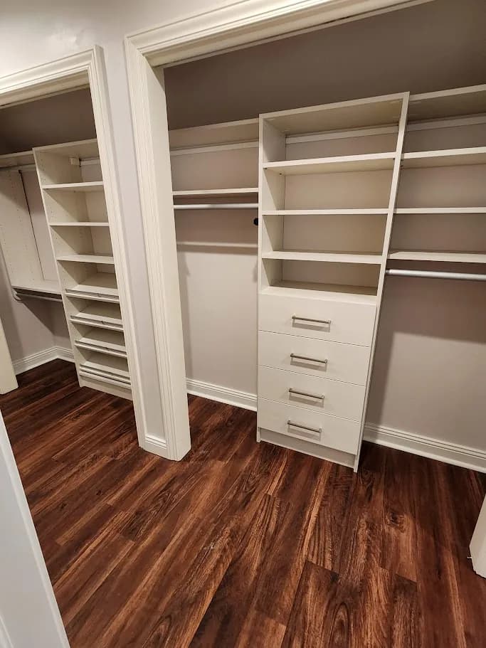 Dual Reach-In Closets with Warm Wood Flooring