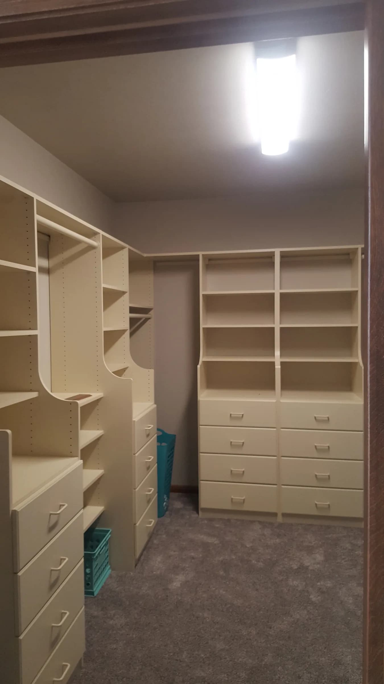 A full-room white walk-in closet