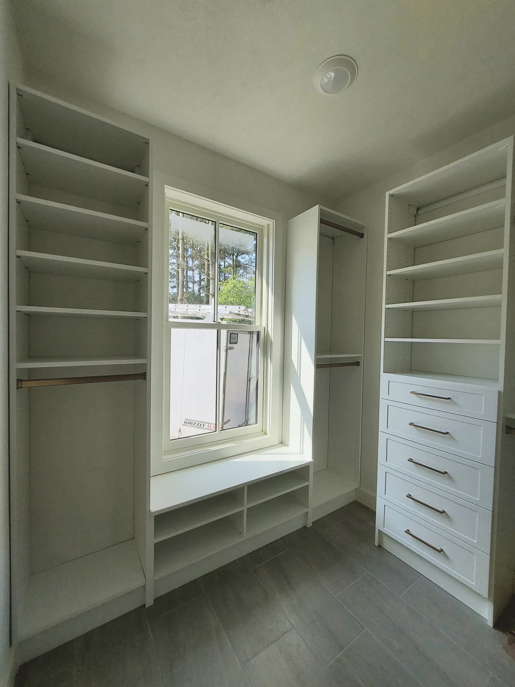 Window-Bench Walk-In with Brass Accents